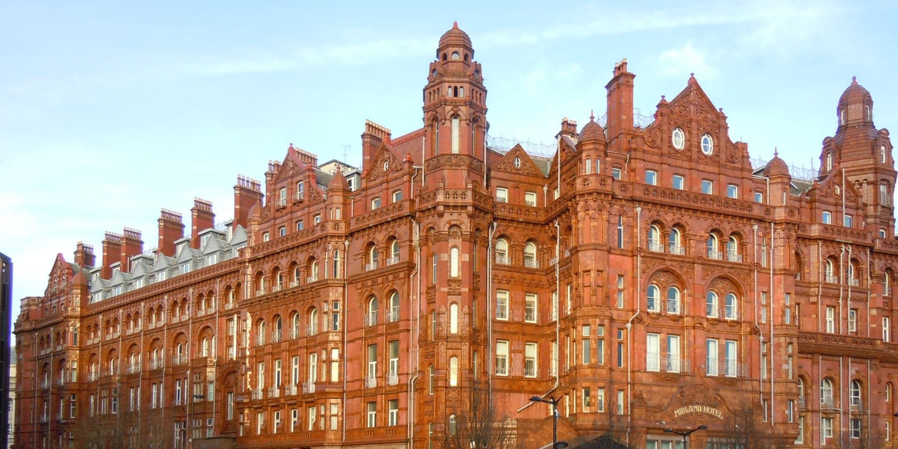 The red terracotta facade of the Midland Hotel on Windmill Street in Manchester