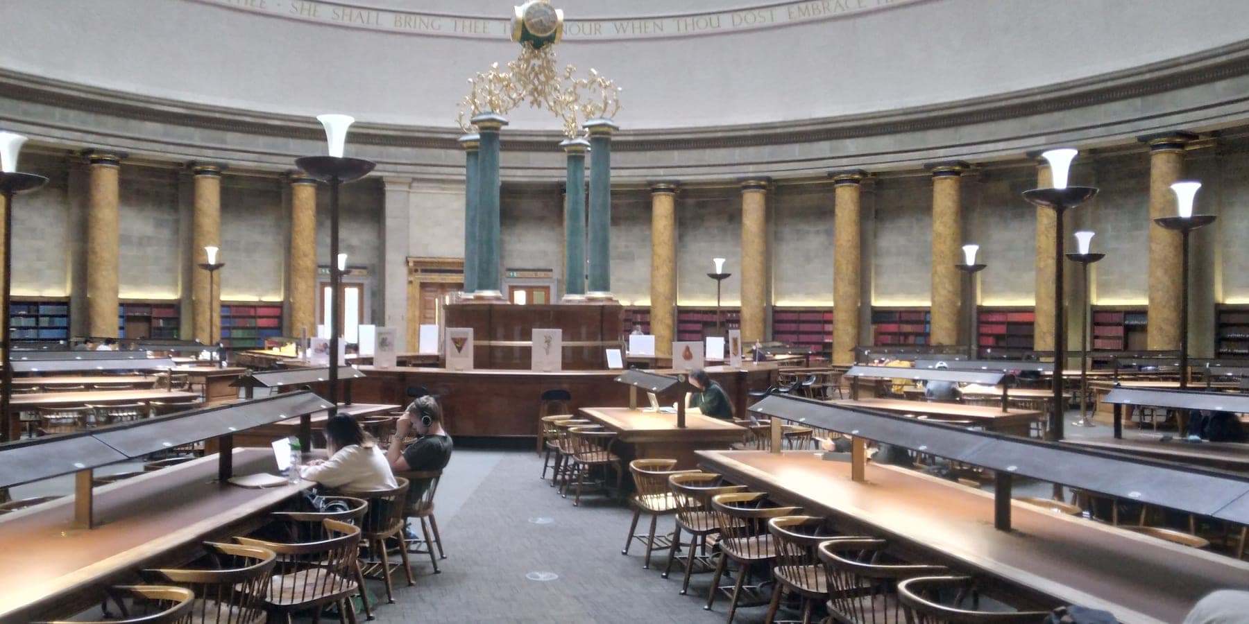The domed Wolfson Reading Room at Manchester Central Library, its long desks set out for study